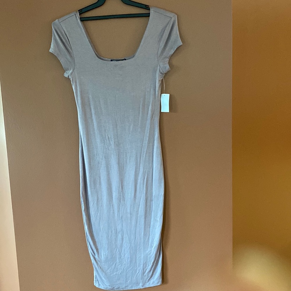 American Dream ladies rayon/spandex bodycon dress in size small. Fully lined.